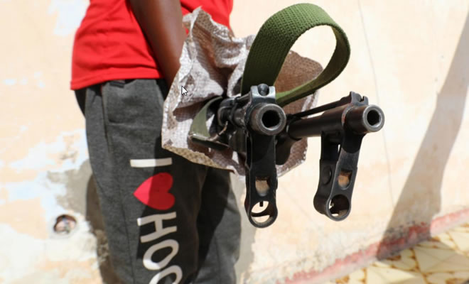 A Somali Dealer holds a weapon looted from a former United Arab Emirates (UAE) military training camp during a Reuters interview in Mogadishu, Somalia April 25, 2018. Reuters/Feisal Omar